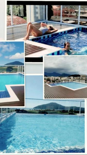 APARTAMENTO PRÓXIMO A PRAIA PISCINA E AREA GOURMET